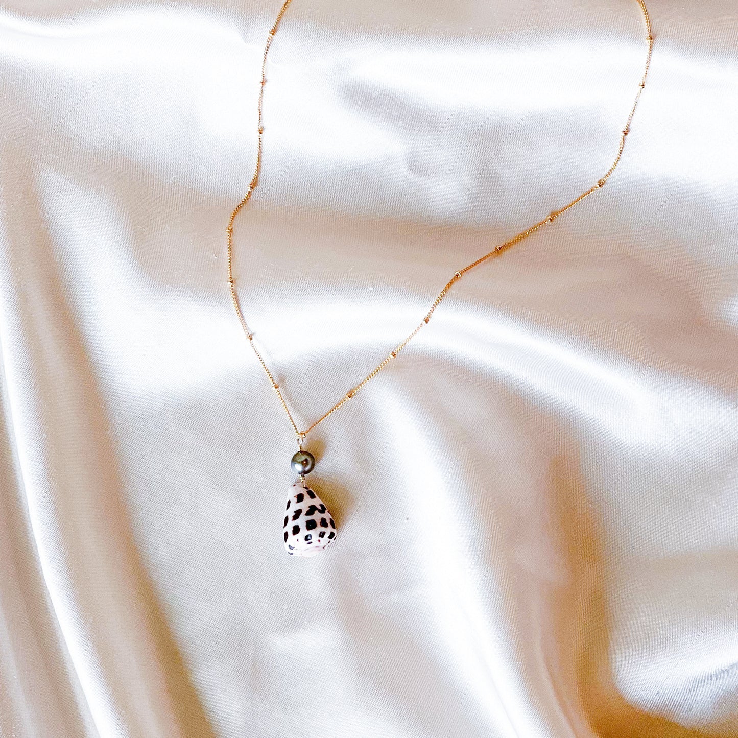 Cone shell necklace with pearl